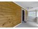 Entryway with wooden wall and white trim with view to the outside through adjacent room at 1150 W 30Th St, Indianapolis, IN 46208