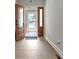 Foyer with Hardwood Floors and Brown Front Door with Ornate Glass and Gray Walls at 1150 W 30Th St, Indianapolis, IN 46208