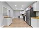 Bright kitchen features stainless steel appliances, butcher block counters, and white cabinetry at 1150 W 30Th St, Indianapolis, IN 46208