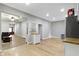 Open-concept kitchen and living room with stylish wood-look flooring and plenty of natural light at 1150 W 30Th St, Indianapolis, IN 46208