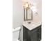 Bathroom boasts a stylish vanity with framed mirror, contemporary lighting, and updated fixtures at 11612 E 75Th St, Indianapolis, IN 46236