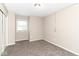 Simple bedroom includes a closet, neutral paint, and window bringing in natural light at 11612 E 75Th St, Indianapolis, IN 46236