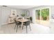Stylish dining room featuring modern furnishings and access to an outdoor deck at 11612 E 75Th St, Indianapolis, IN 46236