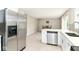 Bright kitchen features stainless steel appliances, tile flooring, and modern countertops at 11612 E 75Th St, Indianapolis, IN 46236