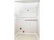 A bright laundry room with tile flooring and built-in shelving at 11612 E 75Th St, Indianapolis, IN 46236