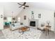 Bright living room with vaulted ceiling, fireplace, ceiling fan, and contemporary furnishings at 11612 E 75Th St, Indianapolis, IN 46236
