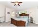 Spacious main bedroom showcases a ceiling fan, large window, and adjoined bathroom entrance at 11612 E 75Th St, Indianapolis, IN 46236