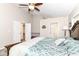 Cozy main bedroom showcases a ceiling fan, large bed, and neutral walls at 11612 E 75Th St, Indianapolis, IN 46236