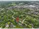 Aerial view of a neighborhood, highlighting nearby amenities such as a golf course and commercial areas at 11807 Rolling Springs Dr, Carmel, IN 46033