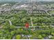 Aerial view of neighborhood, showcasing proximity to a shopping center and major roadways at 11807 Rolling Springs Dr, Carmel, IN 46033