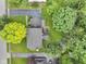 Aerial shot of a property featuring a well-maintained lawn, mature trees and a nice driveway at 11807 Rolling Springs Dr, Carmel, IN 46033