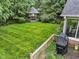 Lush backyard featuring a gazebo and mature trees for privacy at 11807 Rolling Springs Dr, Carmel, IN 46033