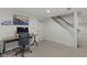 A carpeted basement with desk, stairwell, and good lighting for working from home at 11807 Rolling Springs Dr, Carmel, IN 46033