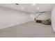 Spacious basement featuring carpeting and neutral paint, perfect for versatile living and storage options at 11807 Rolling Springs Dr, Carmel, IN 46033