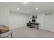 Spacious carpeted basement with recessed lighting and a work desk at 11807 Rolling Springs Dr, Carmel, IN 46033