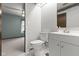 Cozy bathroom with a modern vanity, updated fixtures, and a toilet with access to a bedroom at 11807 Rolling Springs Dr, Carmel, IN 46033