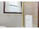Bathroom with tiled wall, glass shower door, and window at 11807 Rolling Springs Dr, Carmel, IN 46033