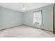 Bedroom featuring neutral walls, carpet, a ceiling fan, and natural light at 11807 Rolling Springs Dr, Carmel, IN 46033