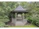 Outdoor gazebo with swing, perfect for relaxation in the backyard at 11807 Rolling Springs Dr, Carmel, IN 46033