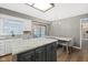 Bright, open kitchen flows into the dining area, featuring granite countertops and stainless steel appliances at 11807 Rolling Springs Dr, Carmel, IN 46033