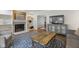 Inviting living room with fireplace, built-in shelves, and hardwood floors, perfect for relaxing or entertaining at 11807 Rolling Springs Dr, Carmel, IN 46033