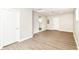 Spacious basement with wood-look floors and entry to kitchen at 12029 Meadow Ln, Indianapolis, IN 46236