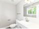 Bathroom with modern vanity, fixtures and a bright window at 12029 Meadow Ln, Indianapolis, IN 46236