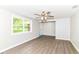 Bright bedroom with neutral walls, wood-look flooring and ceiling fan at 12029 Meadow Ln, Indianapolis, IN 46236