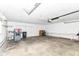 Spacious garage with work bench, shelving, and storage at 12029 Meadow Ln, Indianapolis, IN 46236