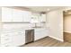 Updated kitchen featuring white cabinets, stainless steel dishwasher and marble counters at 12029 Meadow Ln, Indianapolis, IN 46236
