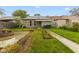 Backyard featuring a fire pit, green grass, and a small garden at 1211 W 10Th St, Muncie, IN 47302