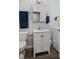 This well-lit bathroom features a modern white vanity with marble countertop, offering a clean and stylish look at 1211 W 10Th St, Muncie, IN 47302