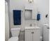 Stylish bathroom features a white vanity with marble countertop, modern fixtures, and coordinated blue towels at 1211 W 10Th St, Muncie, IN 47302