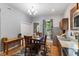 Well-designed kitchen area featuring wooden cabinetry, modern appliances, and a cozy dining nook at 1211 W 10Th St, Muncie, IN 47302