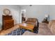 Comfortable living area featuring hardwood floors, a soft sofa, and classic furnishings at 1211 W 10Th St, Muncie, IN 47302