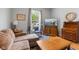 Inviting living room showcasing classic furnishings, hardwood floors, and a serene ambiance at 1211 W 10Th St, Muncie, IN 47302