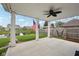 Covered back porch with a ceiling fan, comfortable hammock, and views of a pond and surrounding greenery at 13163 N Departure W Blvd, Camby, IN 46113