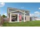 Cozy backyard with covered patio, an American flag, green lawn, and a convenient storage shed at 13163 N Departure W Blvd, Camby, IN 46113