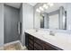 Bathroom featuring double sinks, a large mirror, and modern lighting at 13163 N Departure W Blvd, Camby, IN 46113