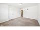 Spacious bedroom with neutral carpet, white walls, and two white doors leading to other areas of the house at 13163 N Departure W Blvd, Camby, IN 46113