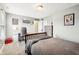 Well-appointed bedroom with a desk, comfortable bed, and unique wall decorations for a stylish and personalized space at 13163 N Departure W Blvd, Camby, IN 46113
