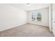 Well-lit bedroom featuring neutral carpet, bright white walls, window overlooking green trees and blinds to control light at 13163 N Departure W Blvd, Camby, IN 46113