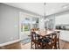 Dining room features a wooden table with seating for six, sliding glass doors to the patio at 13163 N Departure W Blvd, Camby, IN 46113
