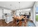 Open concept dining area with seamless flow to the kitchen and living room at 13163 N Departure W Blvd, Camby, IN 46113
