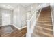 Inviting foyer with hardwood floors, staircase, and a view of the front door at 13163 N Departure W Blvd, Camby, IN 46113