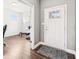 Bright entryway featuring hardwood floors and an open doorway to an office space at 13163 N Departure W Blvd, Camby, IN 46113