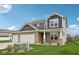 Attractive two-story home with a three-car garage and lush green lawn at 13163 N Departure W Blvd, Camby, IN 46113