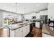 Spacious kitchen featuring a large island, stainless steel appliances, and white cabinets at 13163 N Departure W Blvd, Camby, IN 46113