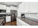 Modern kitchen design featuring stainless steel appliances, granite countertops, and ample white cabinetry at 13163 N Departure W Blvd, Camby, IN 46113
