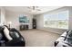 Bright living room with large windows, plush sofas, and modern decor at 13163 N Departure W Blvd, Camby, IN 46113